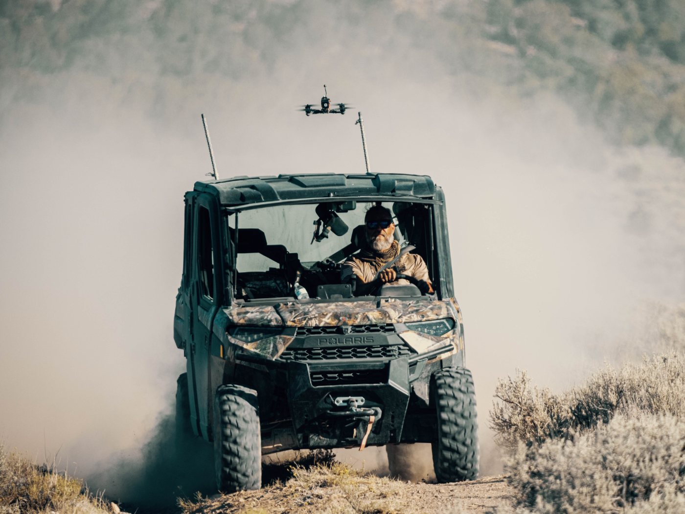 Matrix 7 providing overwatch above a ground team in the field